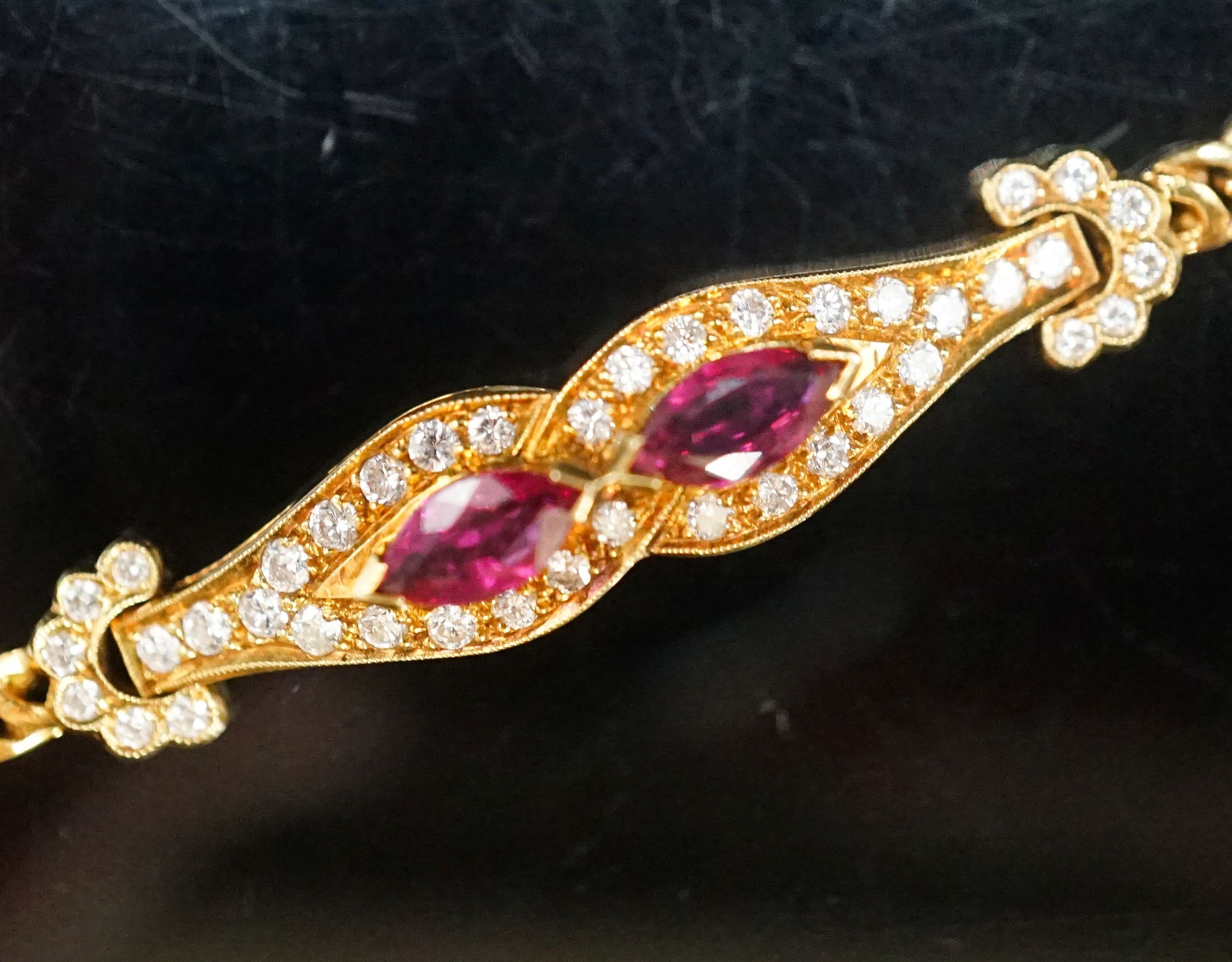 A lady's modern 18k, ruby and diamond set bracelet, 16cm, gross weight 9.2 grams.